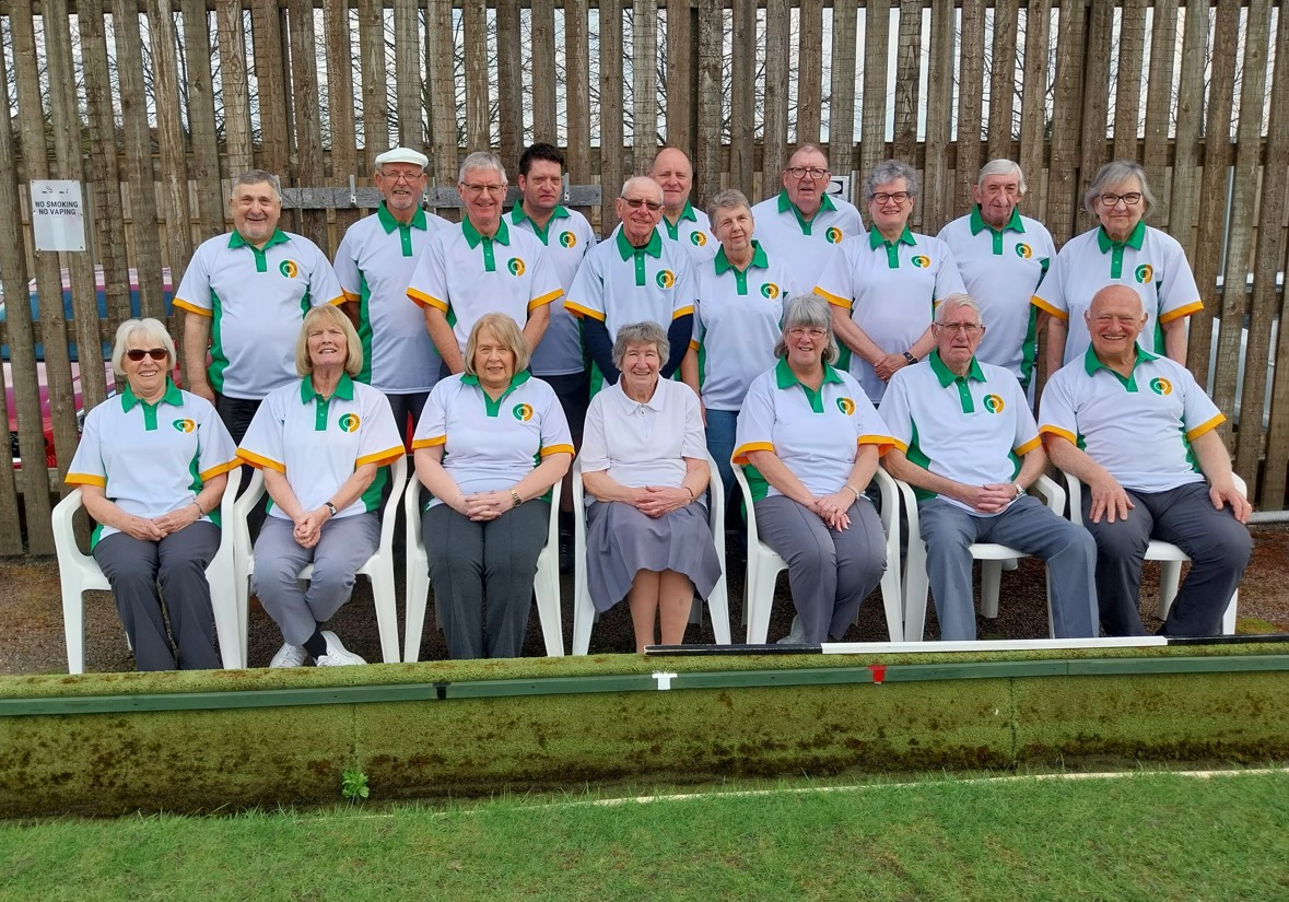 Group photograph of Daybrook Bowls Club members in their new team shirts